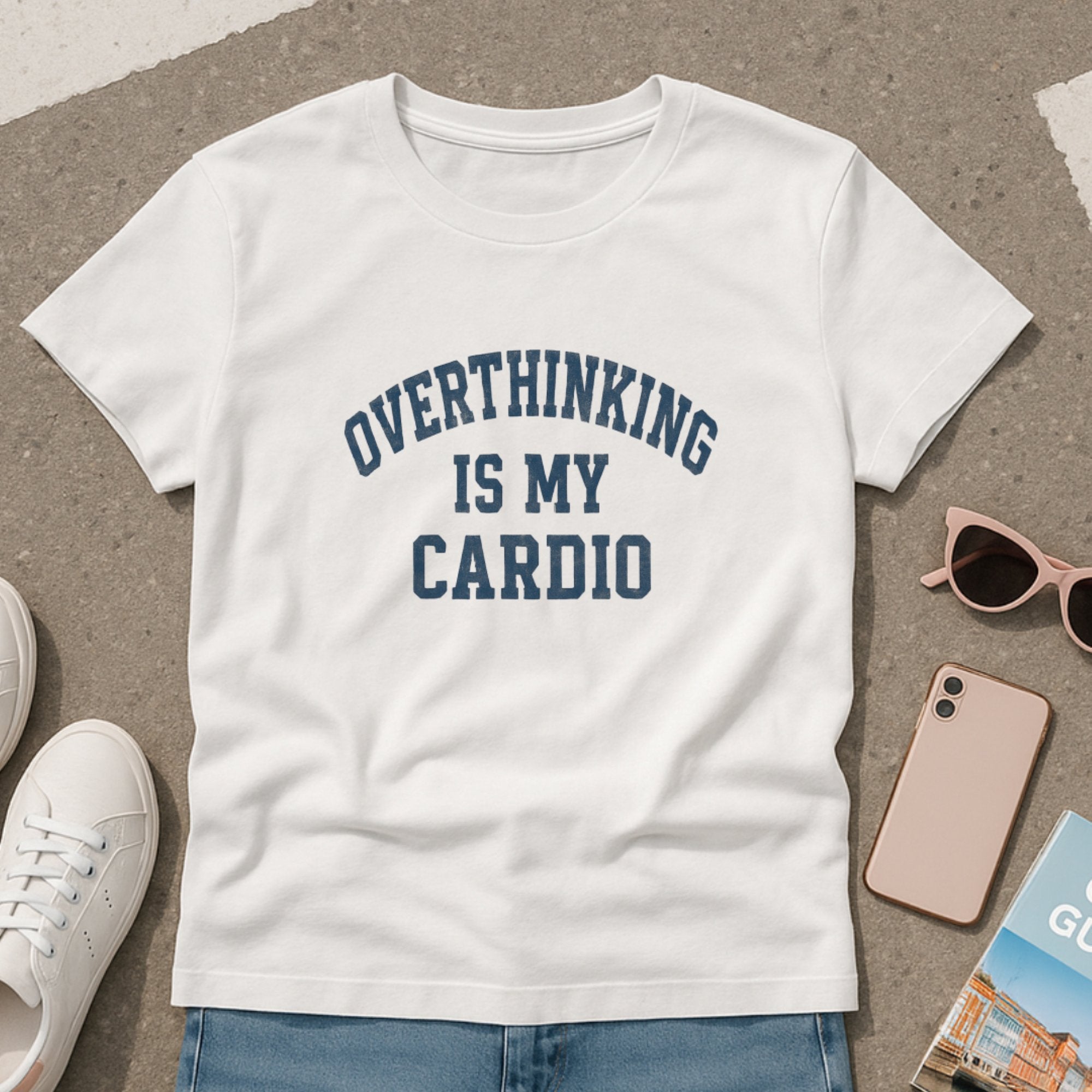 White “Overthinking Is My Cardio” t-shirt with bold collegiate-style lettering, offering a humorous and relatable take on anxiety and mental wellness