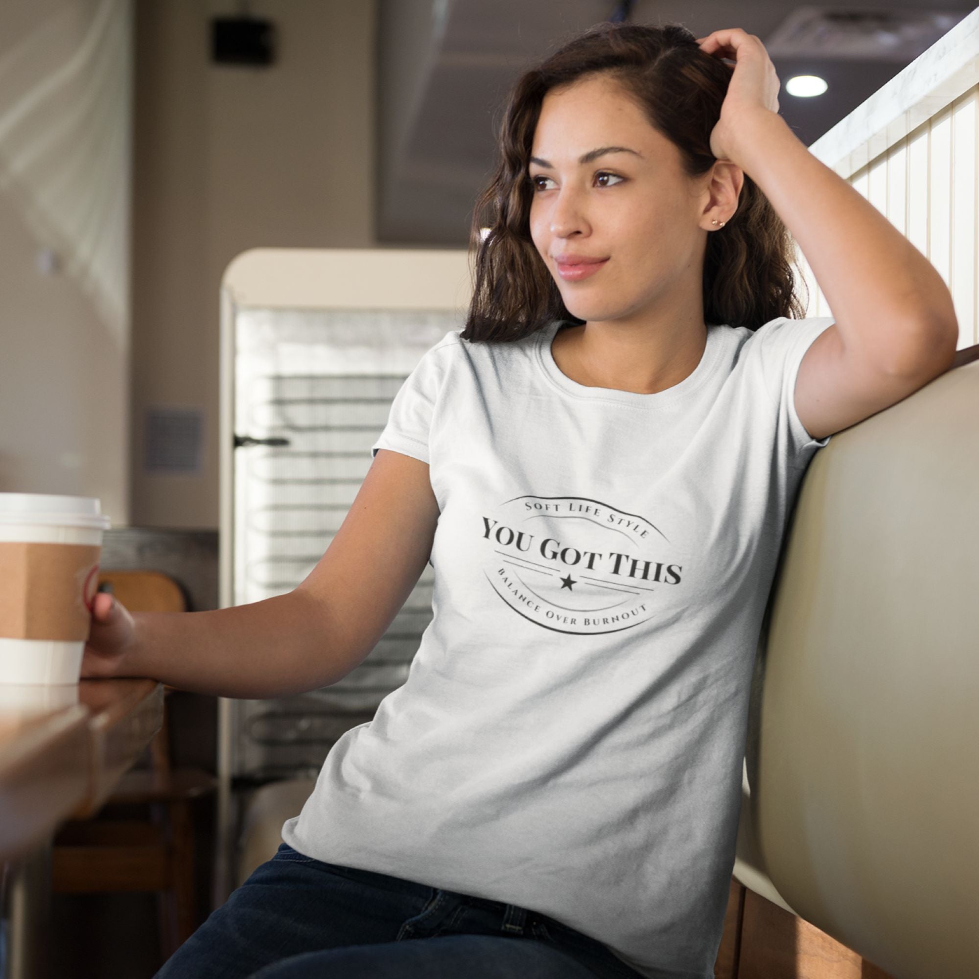 Woman wearing a 'You Got This' t-shirt in a casual setting