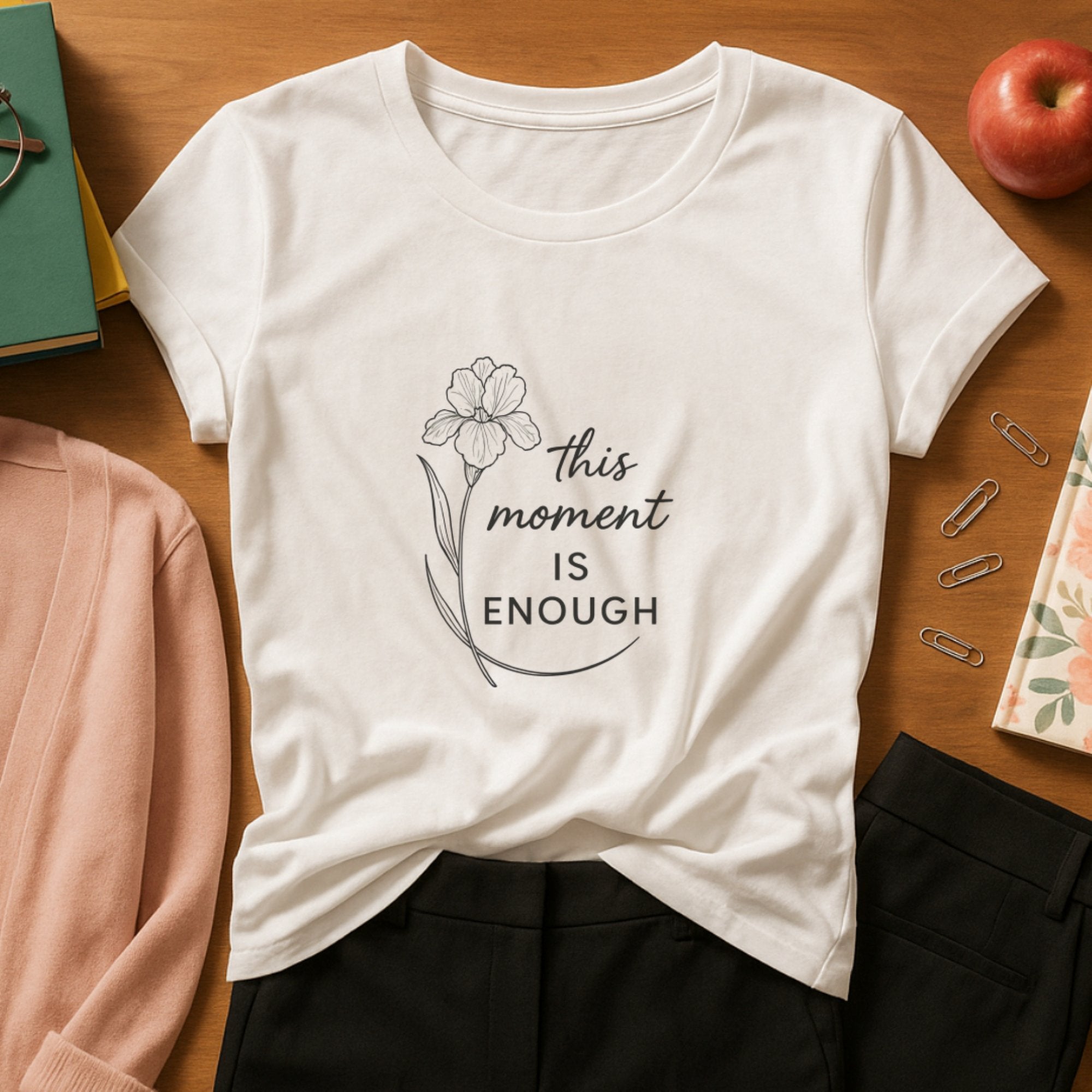 White mindfulness t-shirt with a delicate single-line floral illustration and the calming affirmation “This moment is enough,” promoting presence, self-acceptance, and emotional grounding